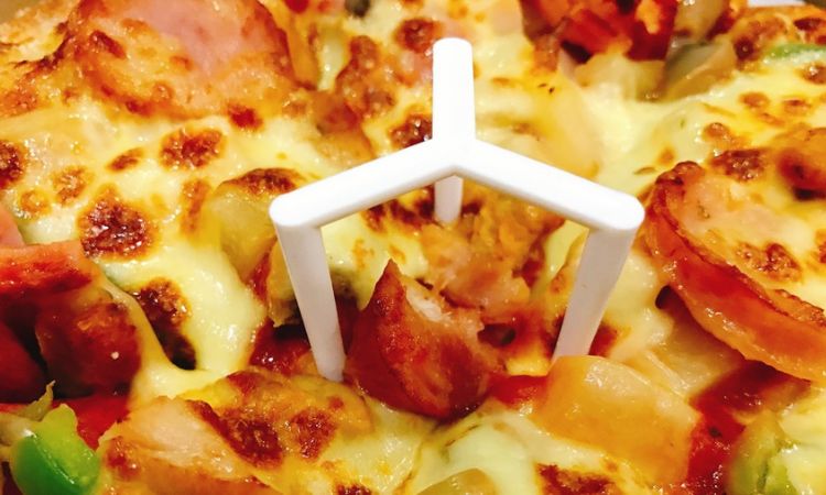 What is the Purpose of the Plastic Piece on a Pizza?